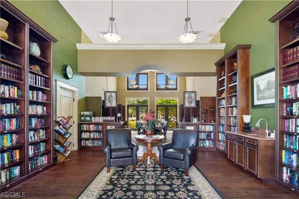 a dining room with lots of furniture and a book shelf