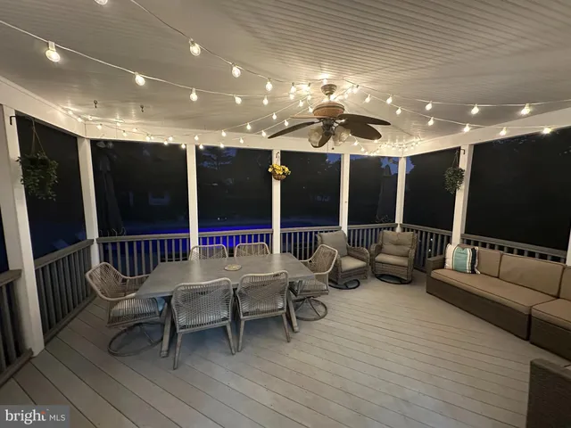 a view of a room with wooden floor and staircase