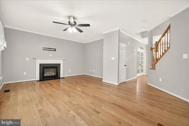 a kitchen with granite countertop cabinets stainless steel appliances and a window