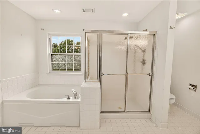 a view of a house with pool and chairs