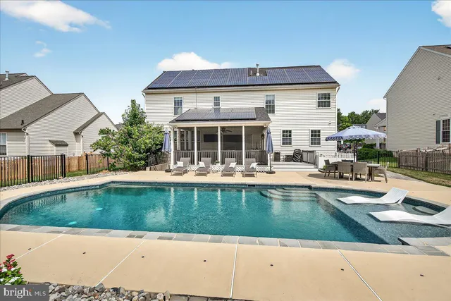a view of a swimming pool with a patio