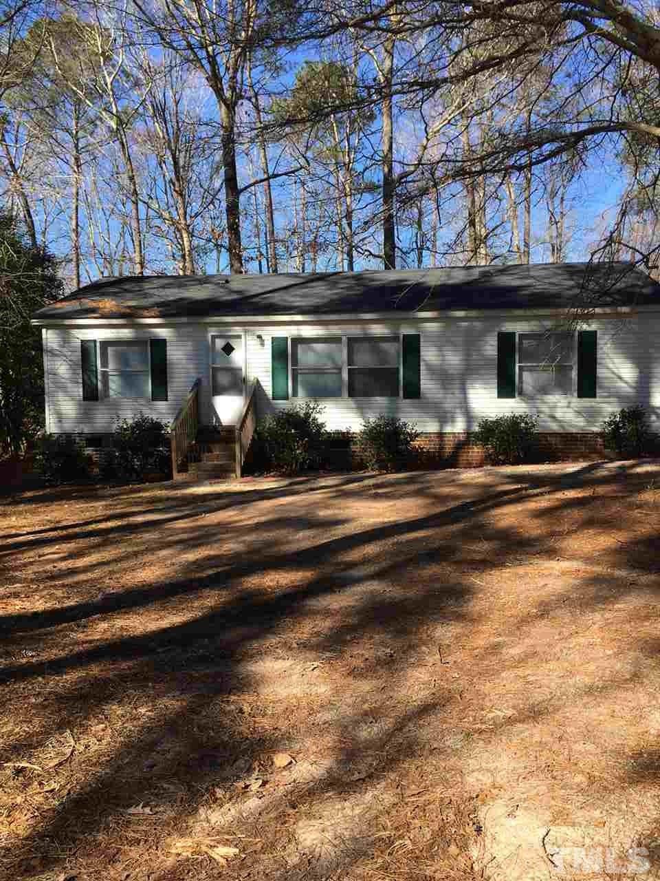 10718 Old Stage Road Raleigh, NC 27603 - Photo 2 of 4 a view of a building with a street