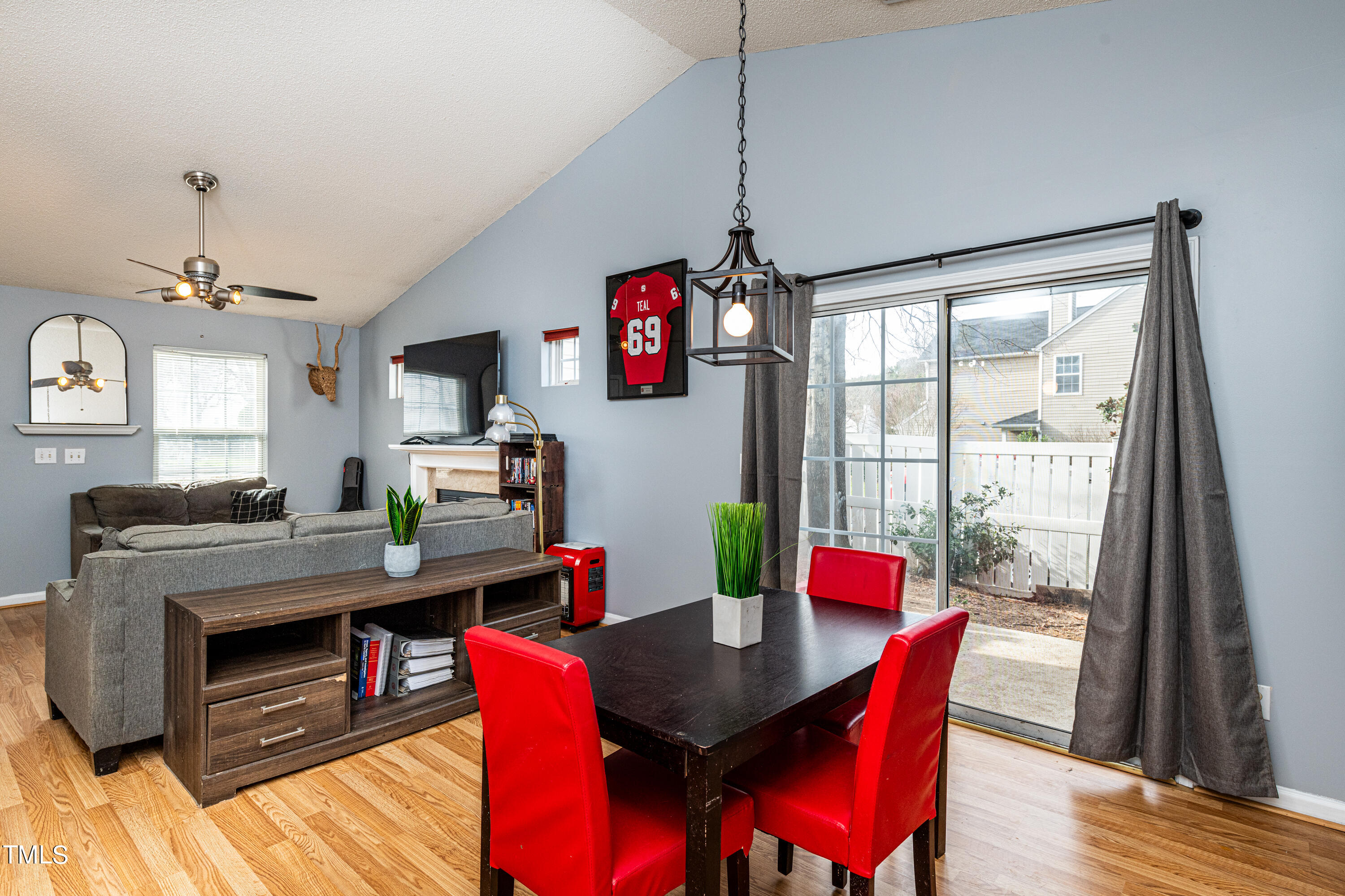 4225 Lake Woodard Drive Raleigh, NC 27604 - Photo 13 of 27 a view of a dining room with furniture window and wooden floor
