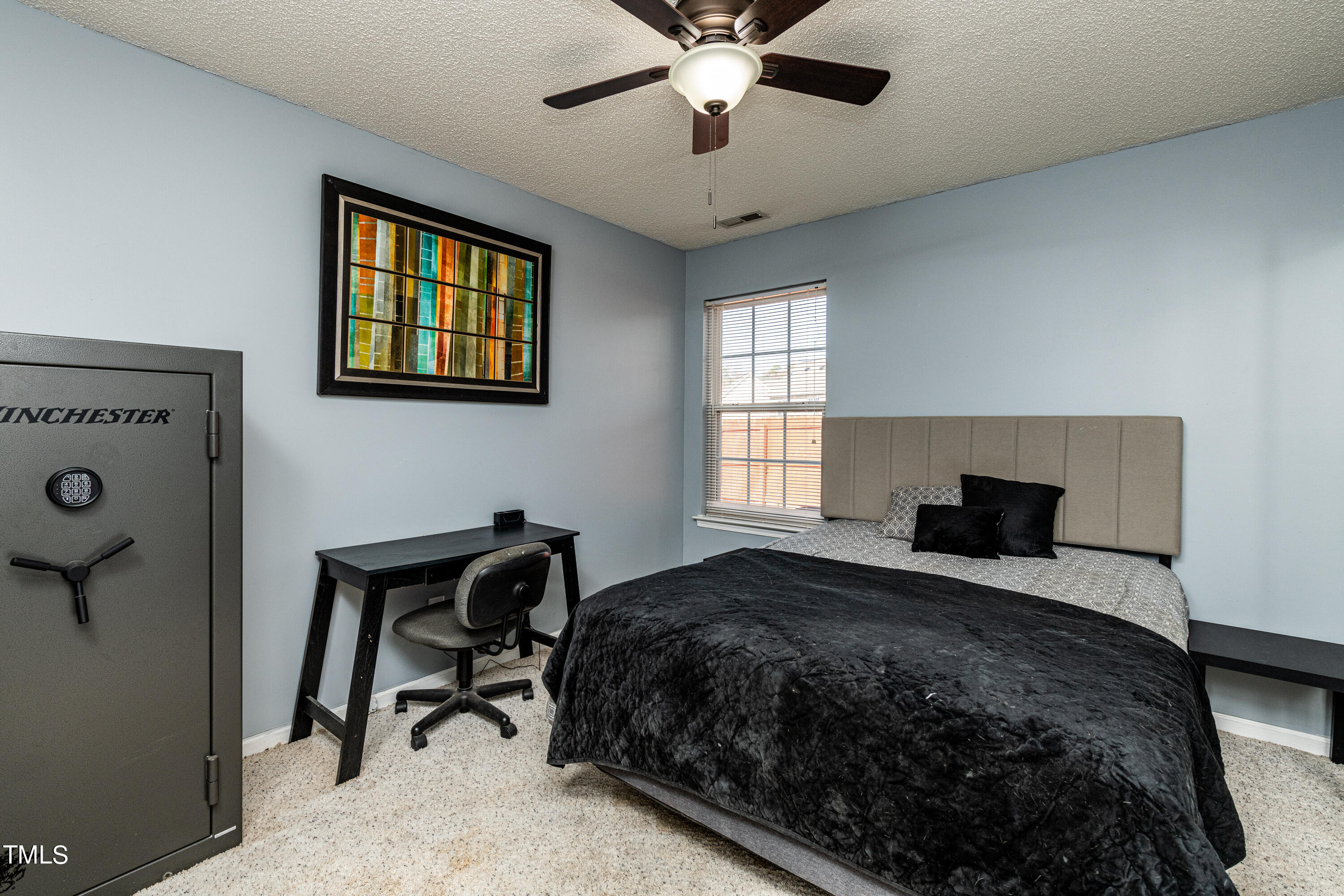 4225 Lake Woodard Drive Raleigh, NC 27604 - Photo 19 of 27 a bedroom with a bed and a window