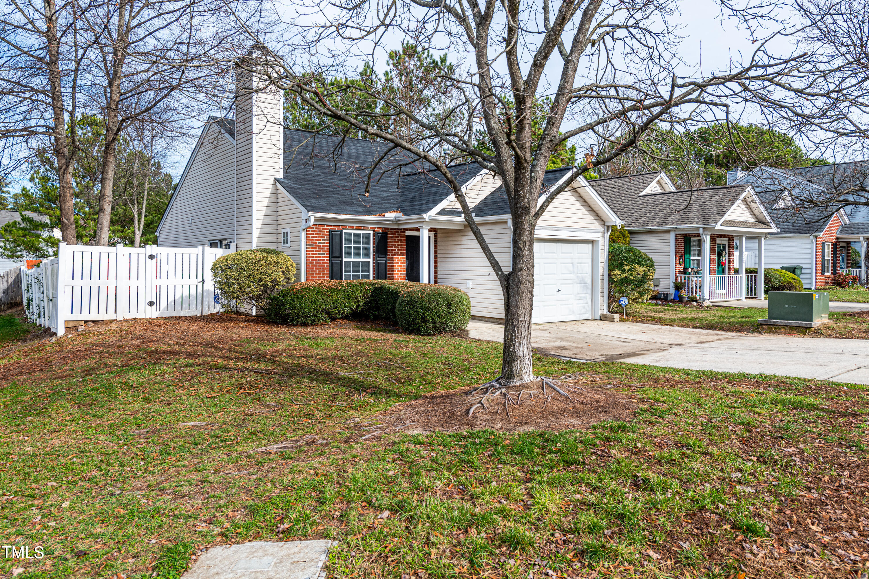 4225 Lake Woodard Drive Raleigh, NC 27604 - Photo 2 of 27 a front view of a house with garden