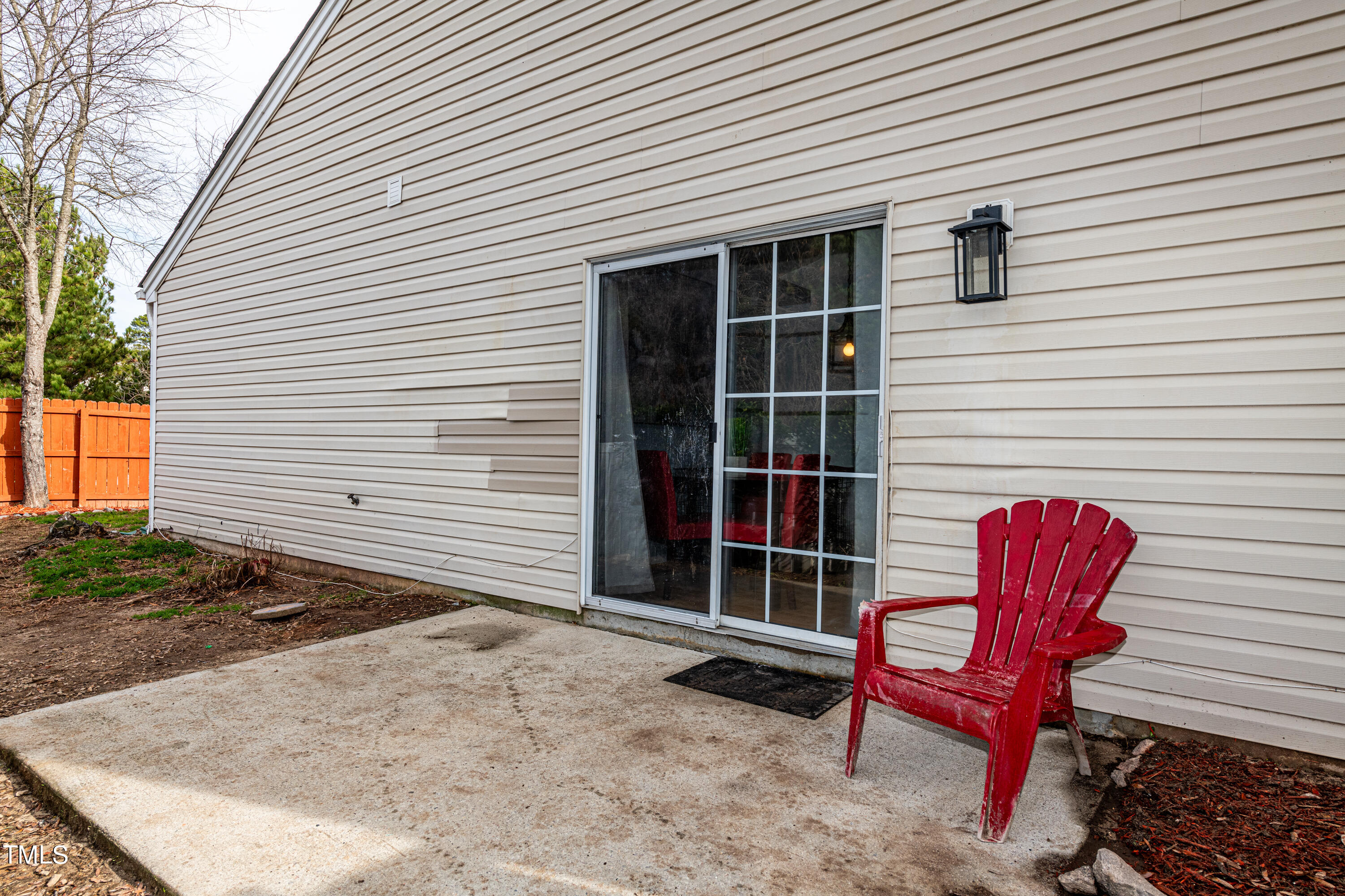 4225 Lake Woodard Drive Raleigh, NC 27604 - Photo 22 of 27 a backyard of a house with table and chairs