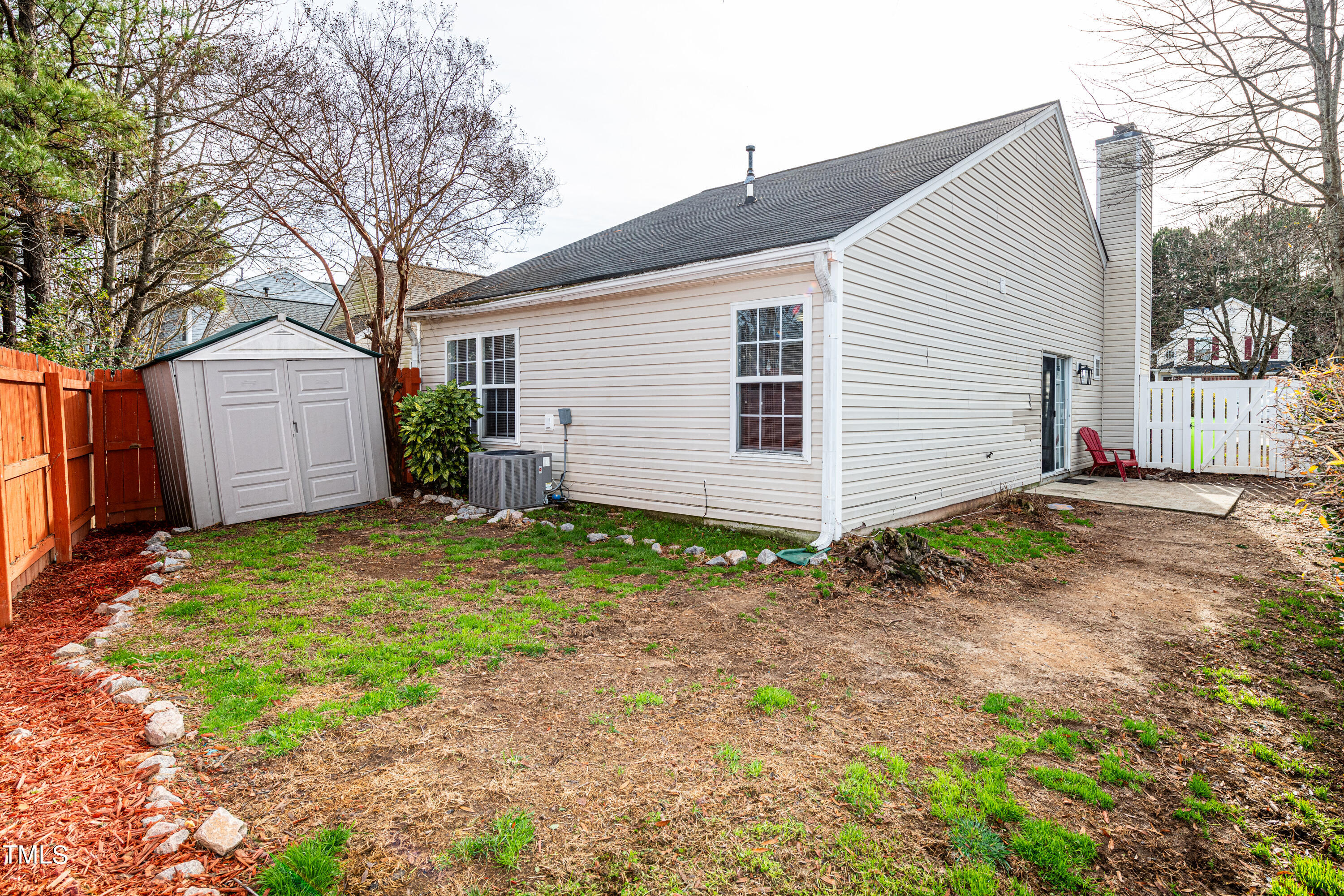 4225 Lake Woodard Drive Raleigh, NC 27604 - Photo 24 of 27 a view of a backyard with a garden