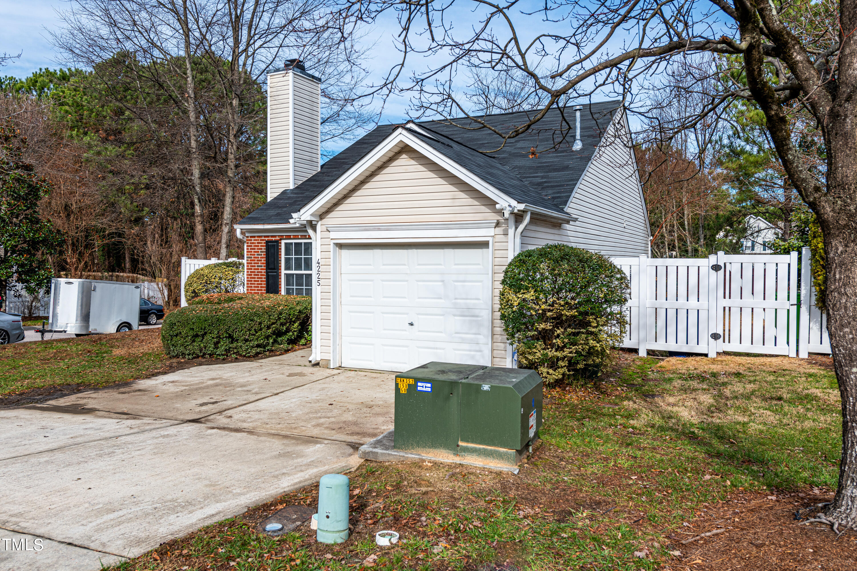 4225 Lake Woodard Drive Raleigh, NC 27604 - Photo 27 of 27 a view of a house with a yard and large tree