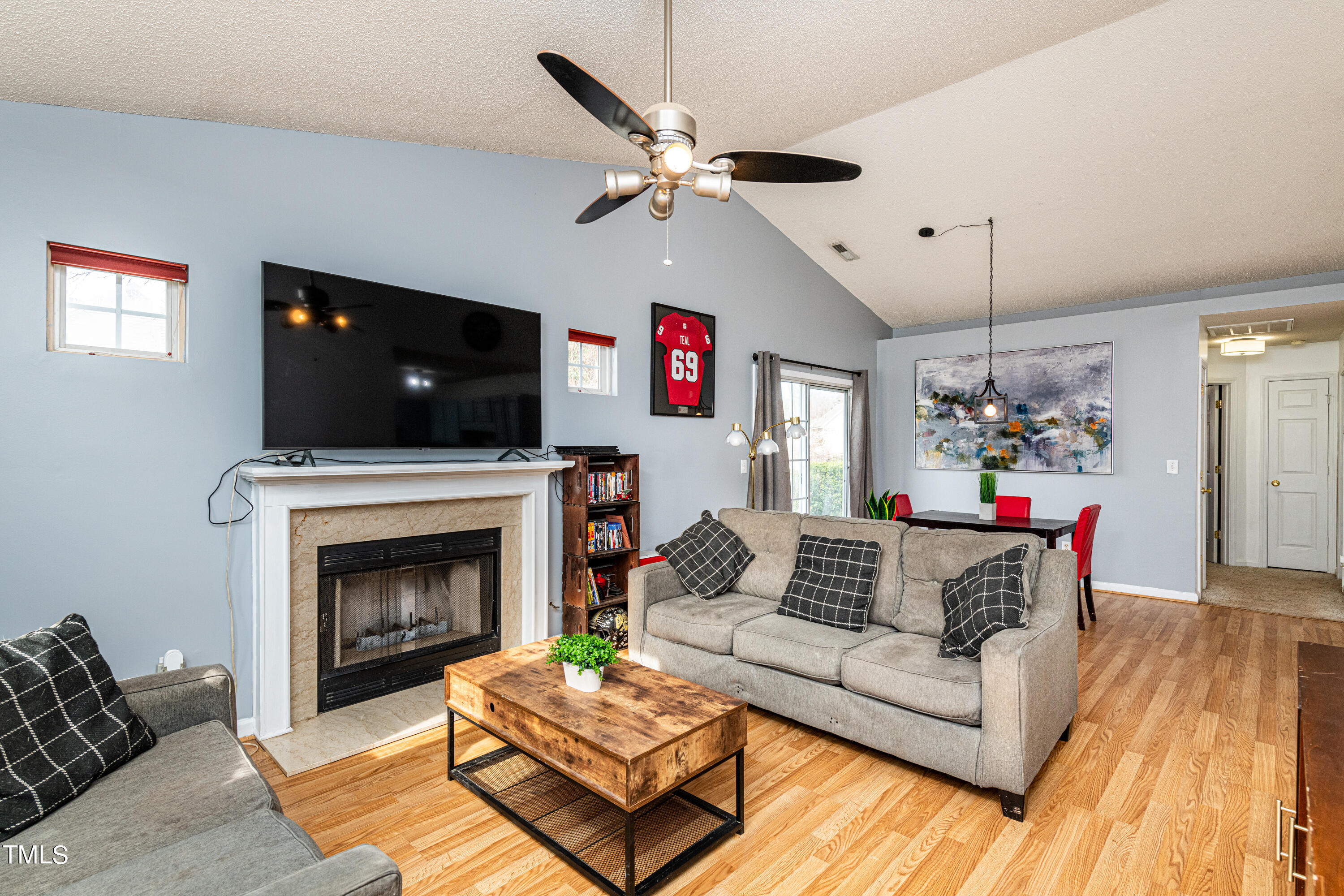 4225 Lake Woodard Drive Raleigh, NC 27604 - Photo 8 of 27 a living room with furniture and a fireplace
