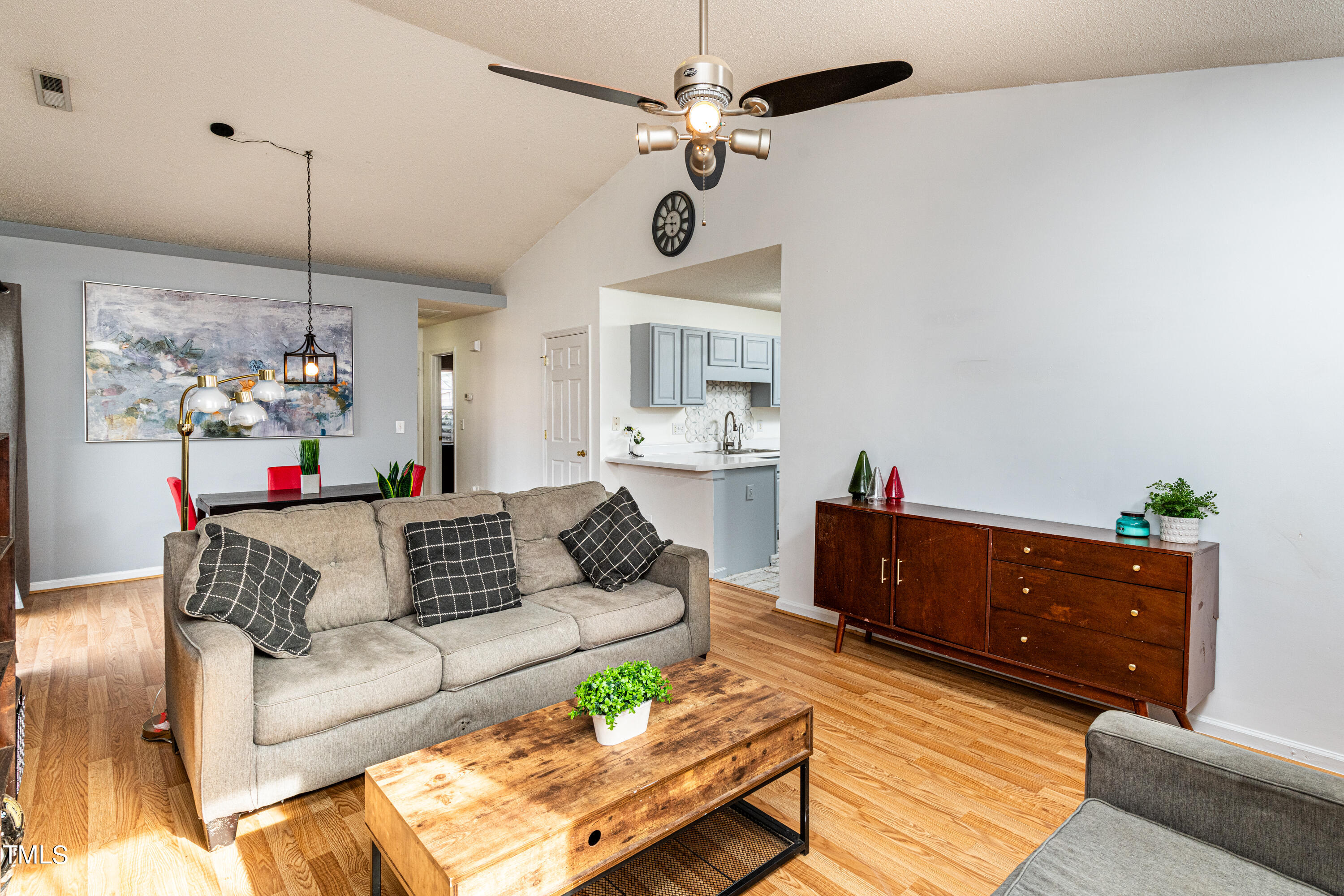 4225 Lake Woodard Drive Raleigh, NC 27604 - Photo 10 of 27 a living room with furniture and a window