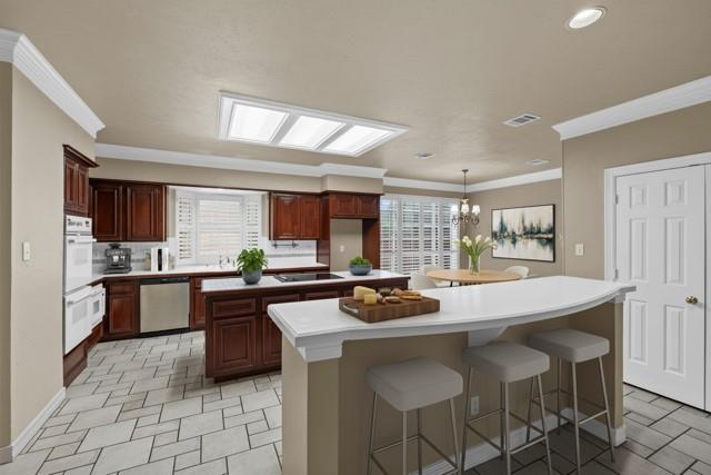 8049 Sunscape Lane Fort Worth, TX 76123 - Photo 12 of 37 a kitchen with a stove a sink and a refrigerator