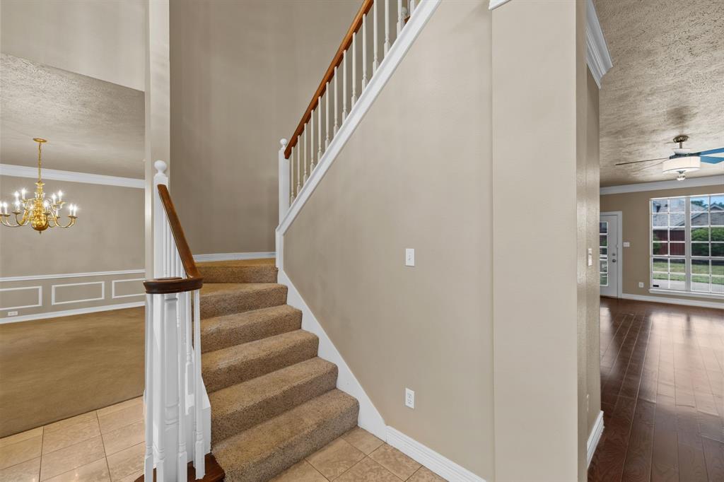 8049 Sunscape Lane Fort Worth, TX 76123 - Photo 22 of 37 a view of entryway and hall with wooden floor