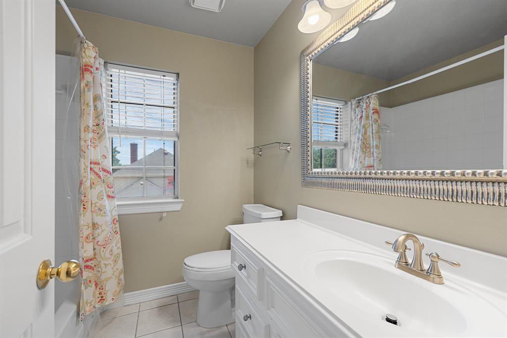 8049 Sunscape Lane Fort Worth, TX 76123 - Photo 26 of 37 a bathroom with a sink toilet and shower