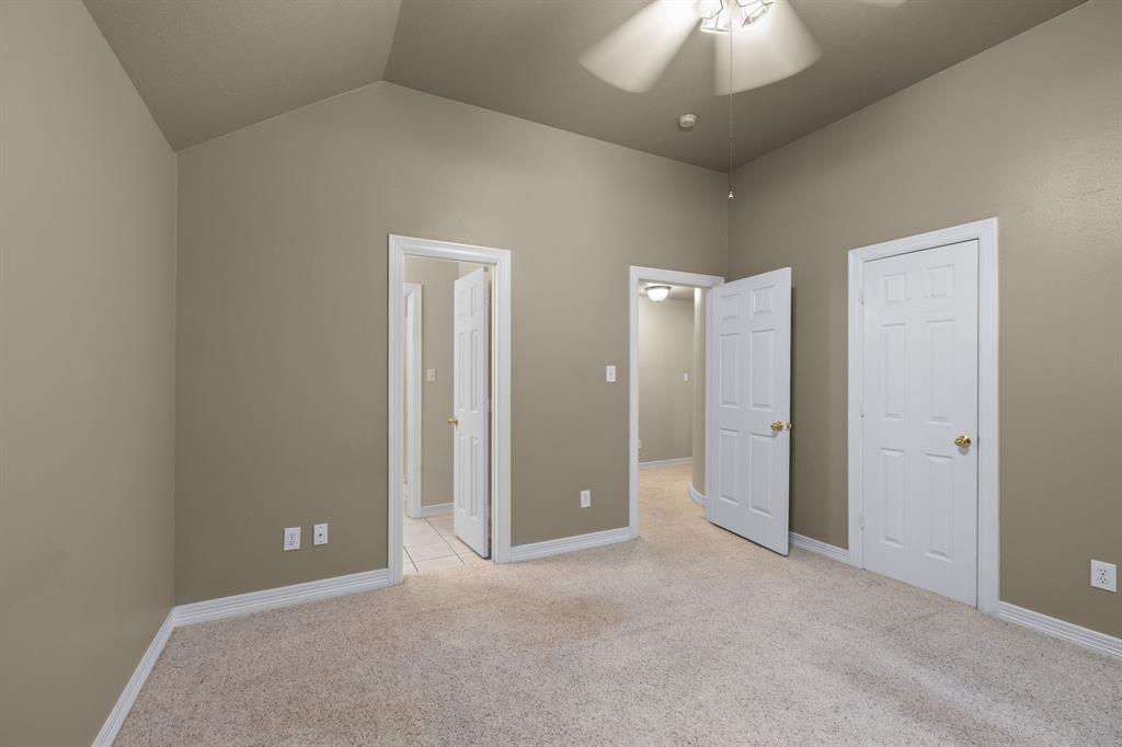 8049 Sunscape Lane Fort Worth, TX 76123 - Photo 29 of 37 a view of an empty room and a chandelier fan