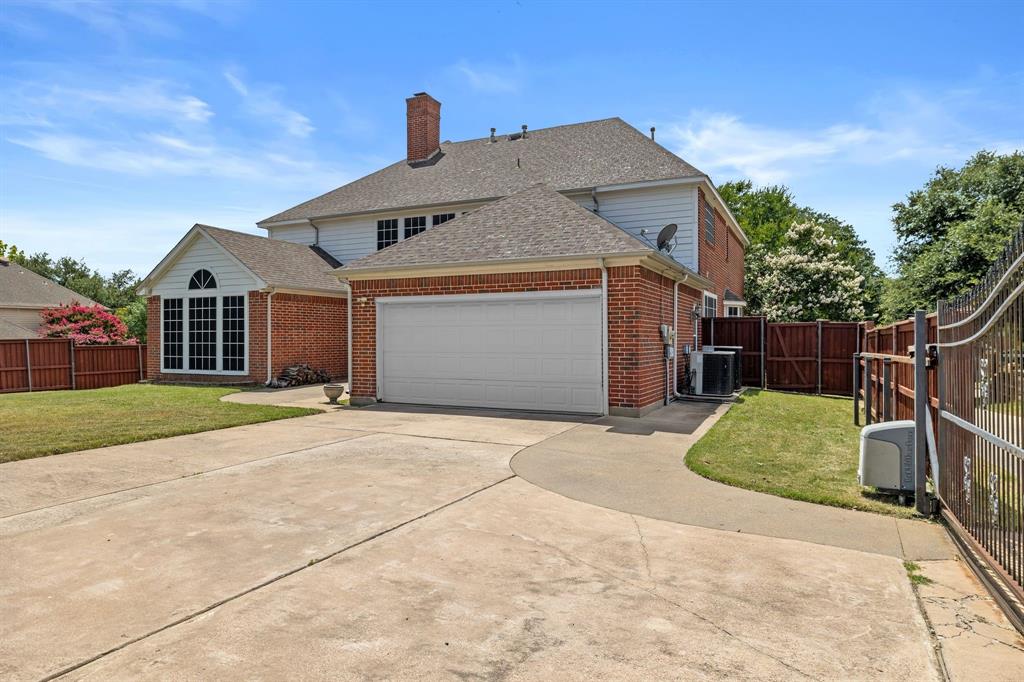 8049 Sunscape Lane Fort Worth, TX 76123 - Photo 36 of 37 a front view of a house with a yard and garage