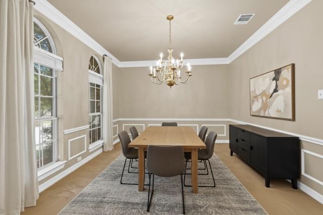 8049 Sunscape Lane Fort Worth, TX 76123 - Photo 6 of 37 a view of a dining room with furniture a chandelier and window
