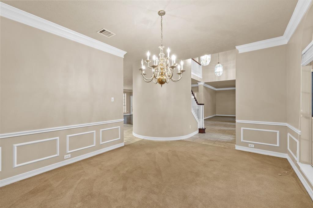 8049 Sunscape Lane Fort Worth, TX 76123 - Photo 7 of 37 a view of a livingroom with a chandelier