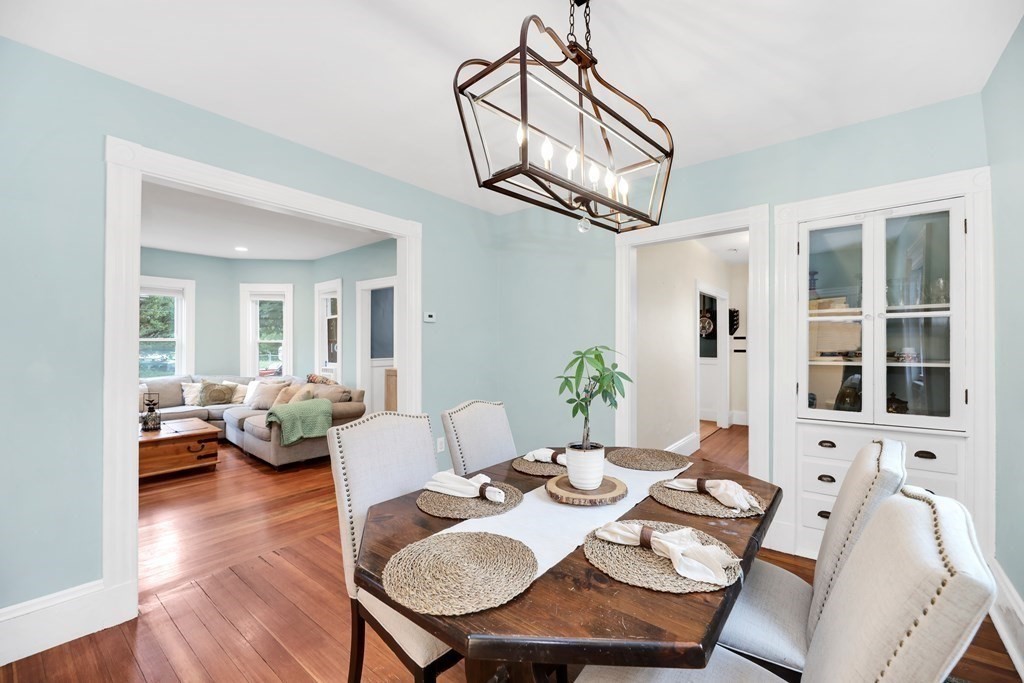 79 Harvard Avenue Boston, MA 02136 - Photo 14 of 33 a view of a dining room with furniture wooden floor and a chandelier