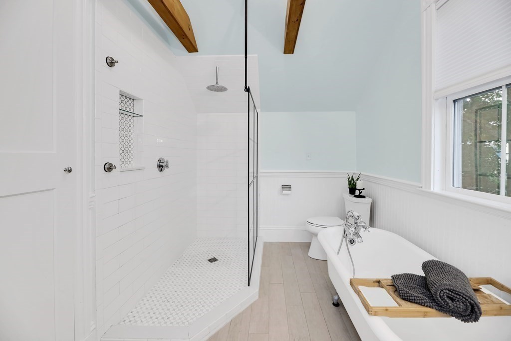 79 Harvard Avenue Boston, MA 02136 - Photo 27 of 33 a bathroom with a sink and mirror with bathtub