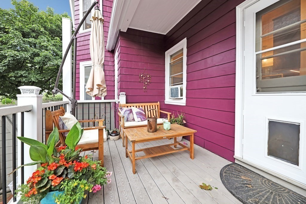 79 Harvard Avenue Boston, MA 02136 - Photo 28 of 33 a backyard of a house with outdoor seating