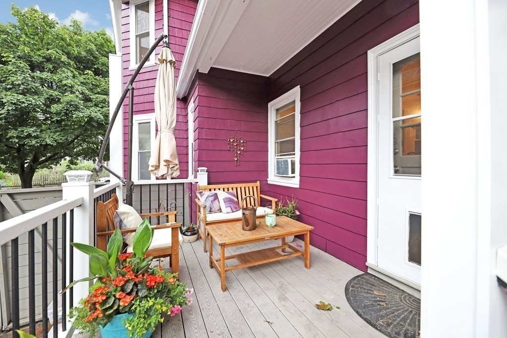 79 Harvard Avenue Boston, MA 02136 - Photo 29 of 33 a bench is sitting in front of a house