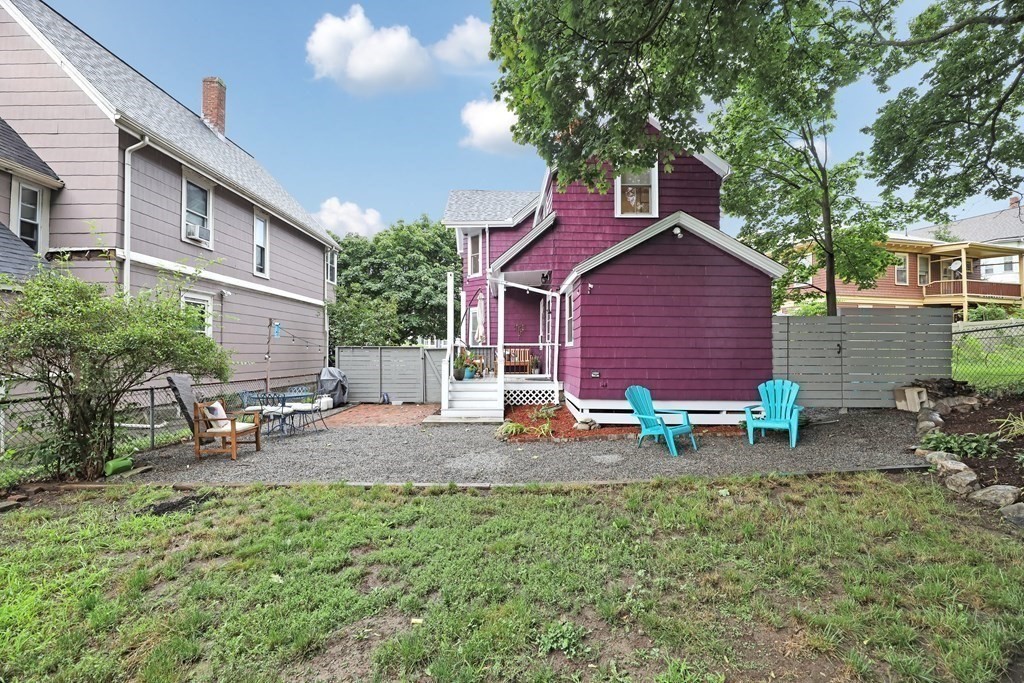 79 Harvard Avenue Boston, MA 02136 - Photo 30 of 33 a view of a house with a yard and sitting area