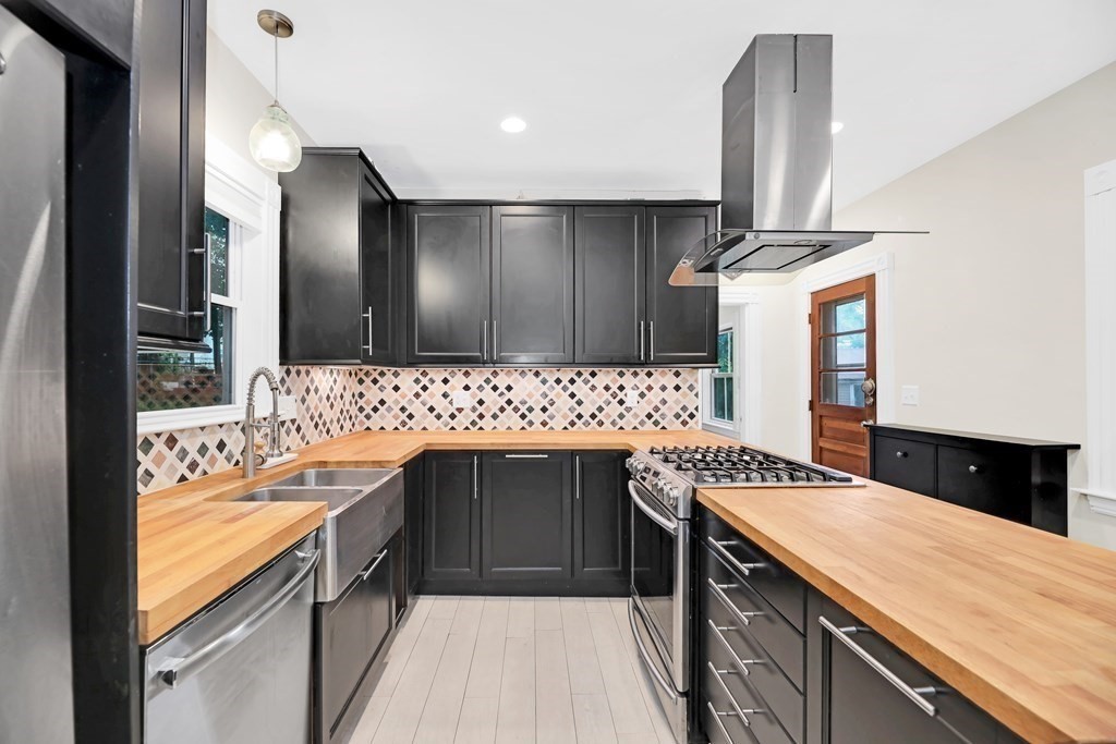 79 Harvard Avenue Boston, MA 02136 - Photo 6 of 33 a kitchen with a sink and a refrigerator