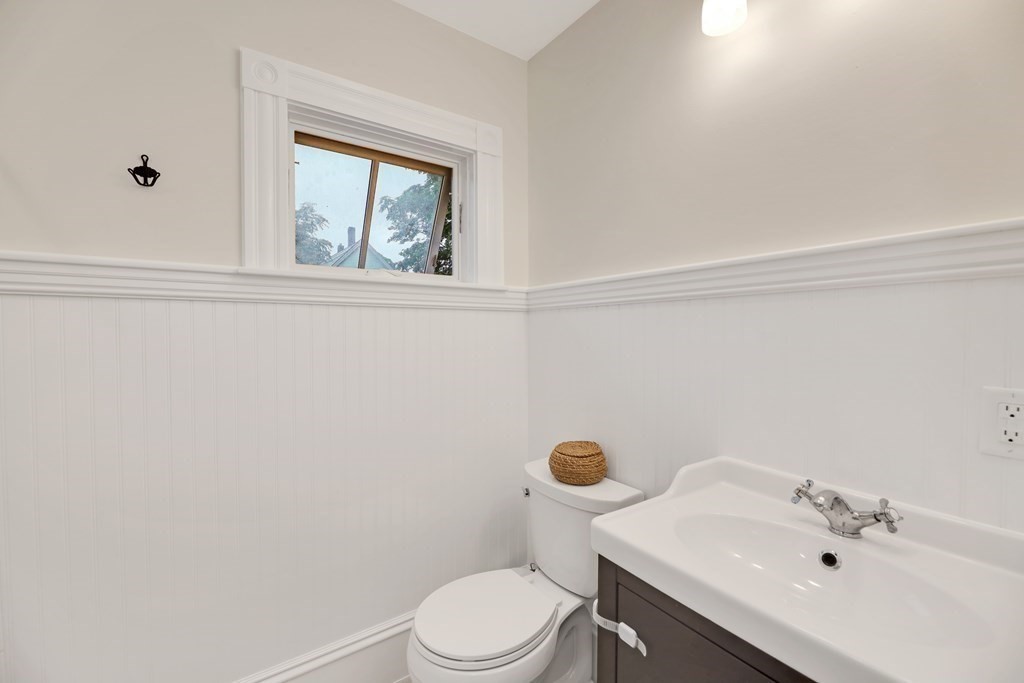 79 Harvard Avenue Boston, MA 02136 - Photo 8 of 33 a white toilet sitting next to a bathroom sink