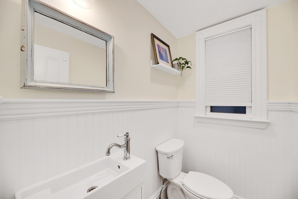 79 Harvard Avenue Boston, MA 02136 - Photo 9 of 33 a white toilet sitting next to a bathroom sink