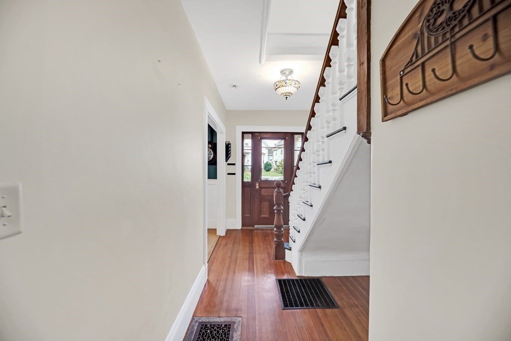 79 Harvard Avenue Boston, MA 02136 - Photo 10 of 33 a view of entryway and hall with wooden floor