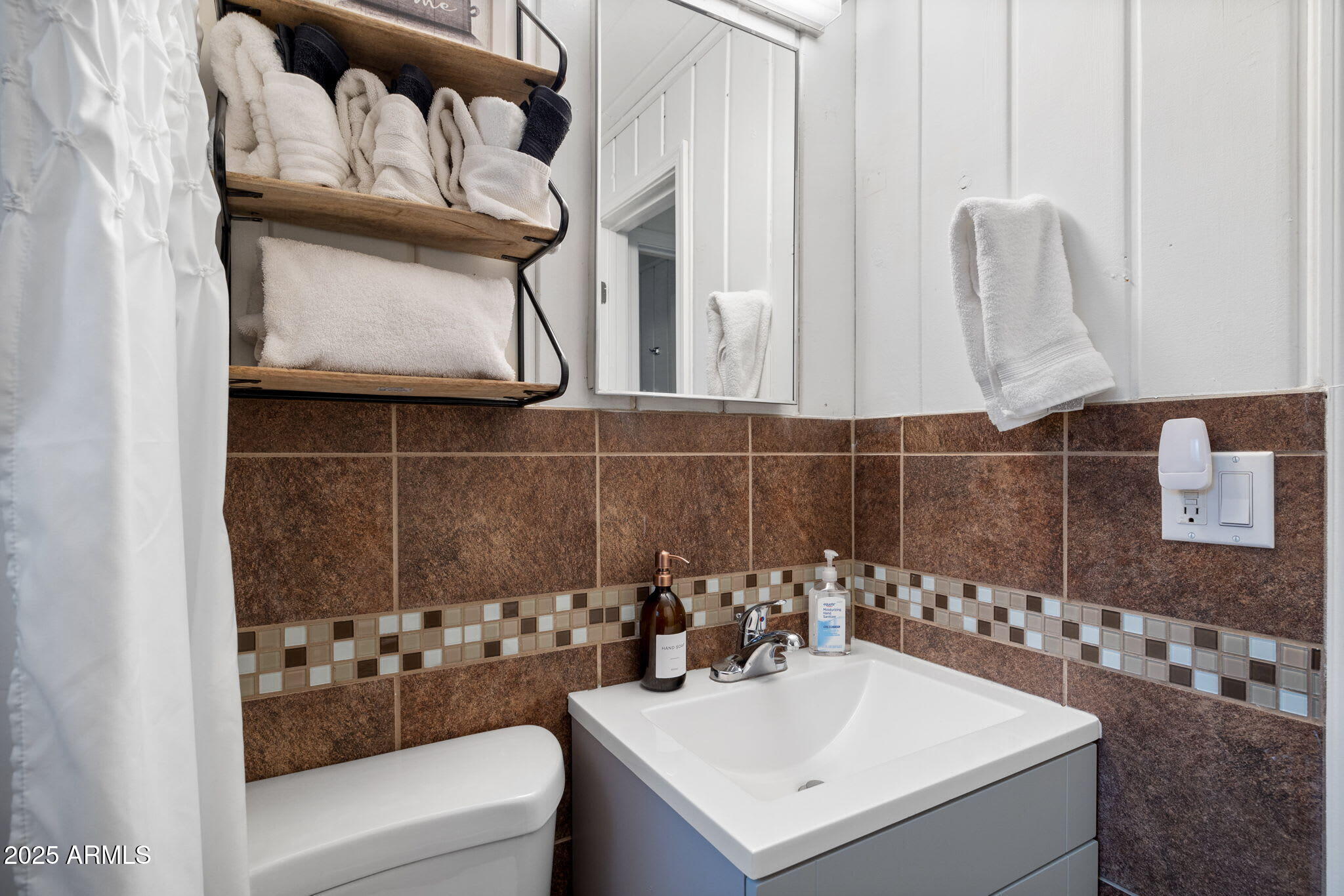6 County Road, Unit 4 Eagar, AZ 85925 - Photo 11 of 26 a bathroom with a sink a mirror and a shower