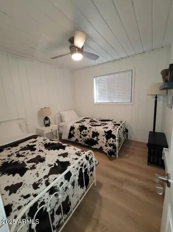 a bedroom with bed and a window