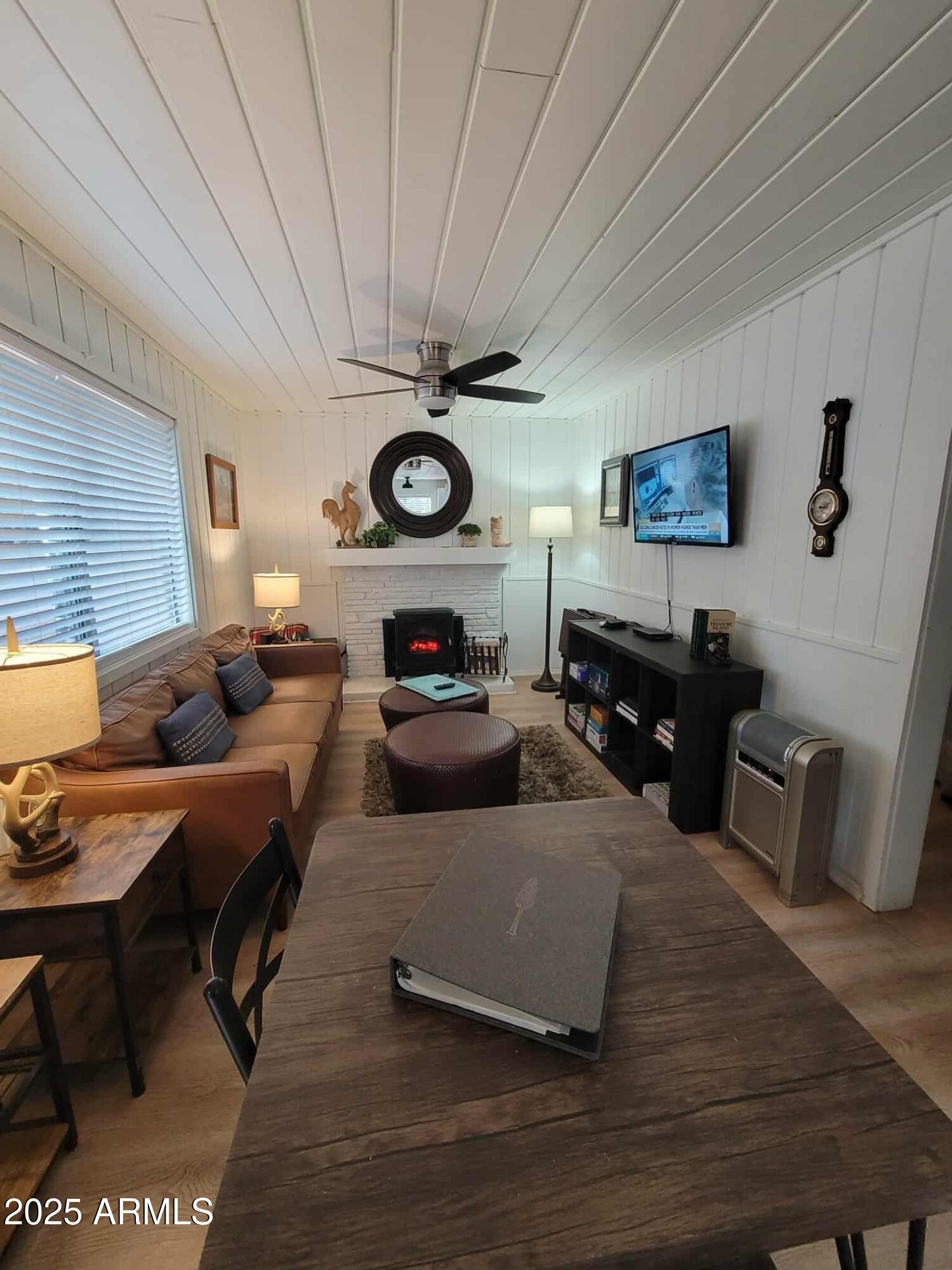 6 County Road, Unit 4 Eagar, AZ 85925 - Photo 20 of 26 a living room with furniture and a flat screen tv