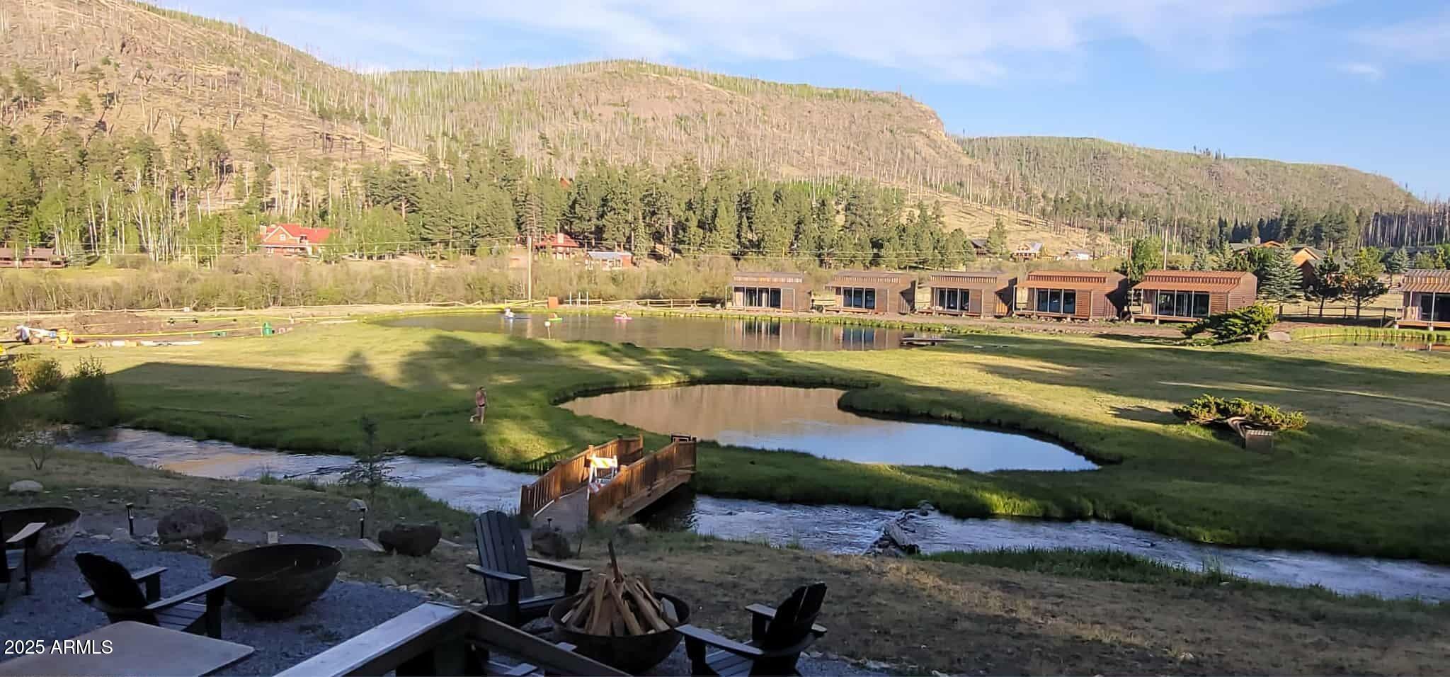 6 County Road, Unit 4 Eagar, AZ 85925 - Photo 22 of 26 a view of a lake with a mountain