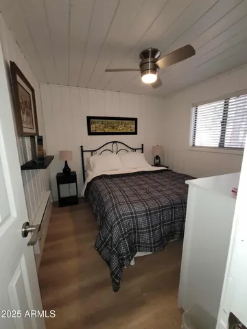 a bedroom with a bed and a couch