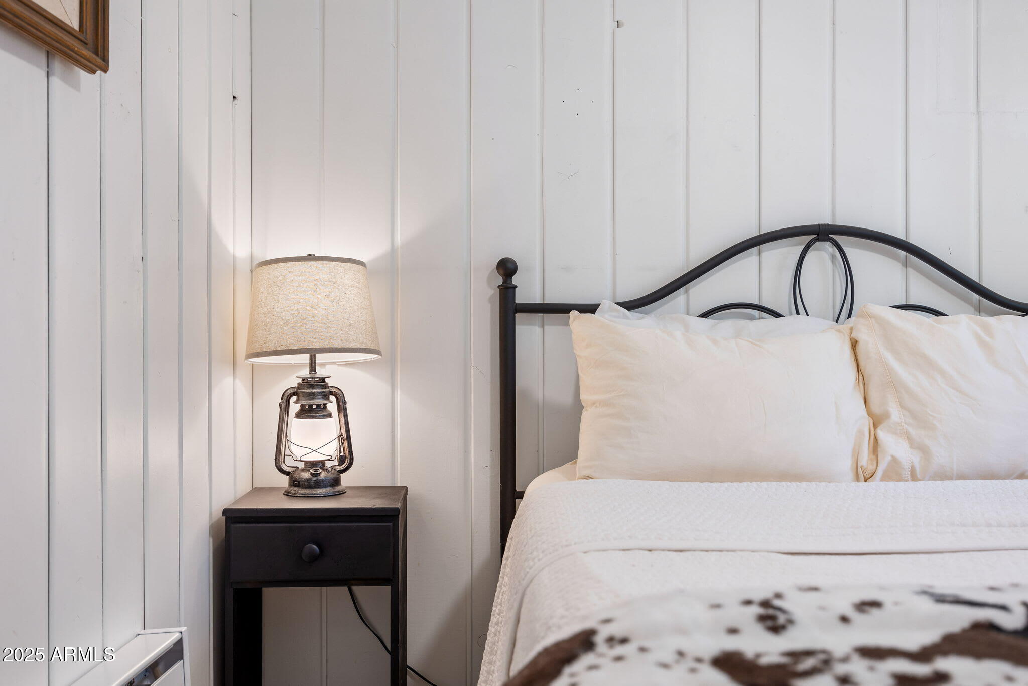 6 County Road, Unit 4 Eagar, AZ 85925 - Photo 9 of 26 a bedroom with a bed and a potted plant on the dresser