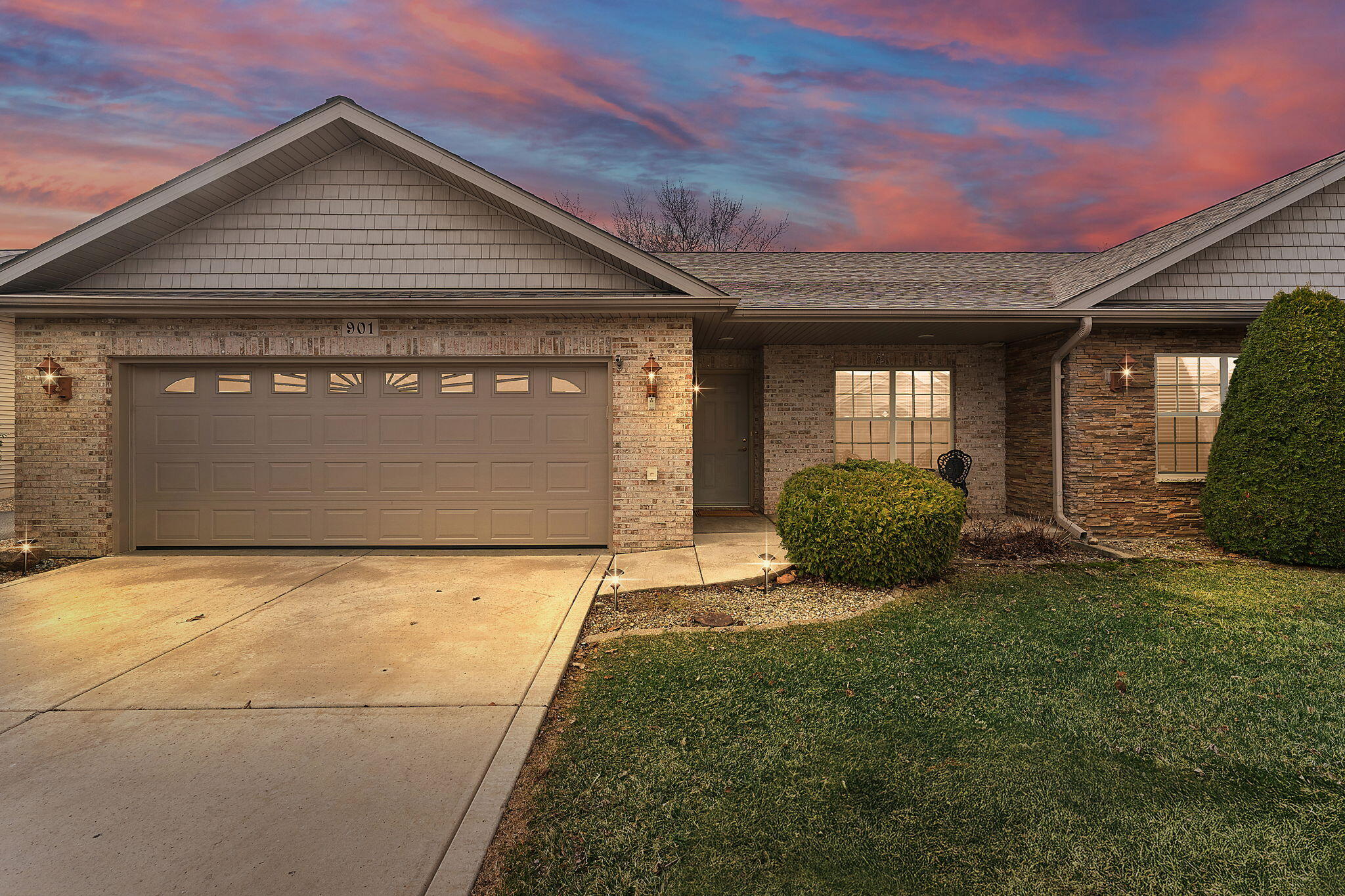 901 Veterans Lane Crown Point, IN 46307 - Photo 1 of 40 a front view of a house with a yard and garage