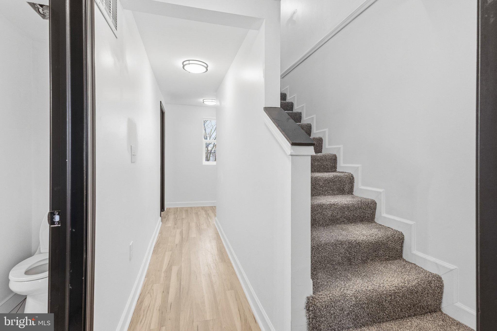 610 Scott Street Baltimore, MD 21230 - Photo 14 of 23 Inviting hallway with staircase charm.