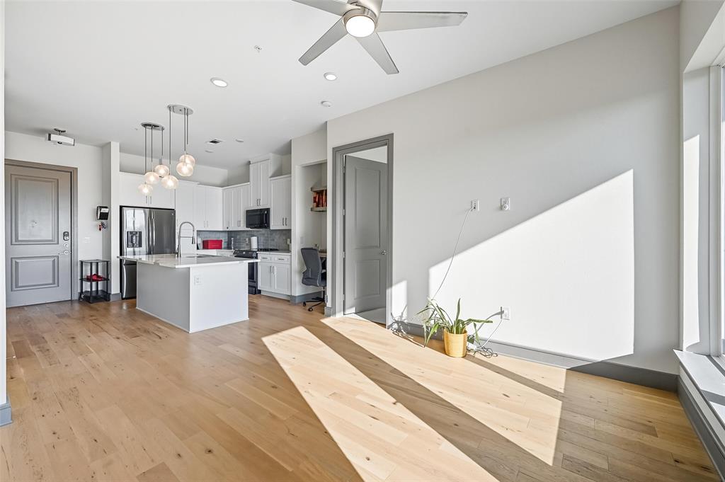 2700 Old Denton Road, Unit 3310 Carrollton, TX 75007 - Photo 1 of 21 a open kitchen with cabinets and white stainless steel appliances