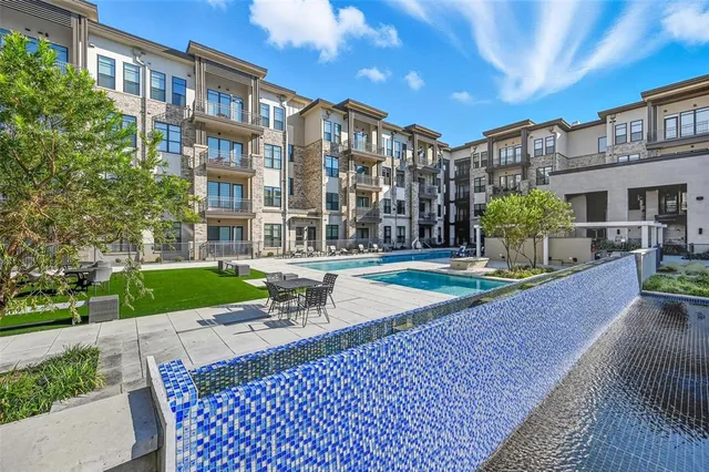 a view of a building with a garden and plants