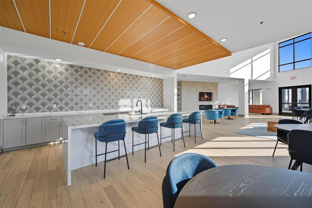 2700 Old Denton Road, Unit 3310 Carrollton, TX 75007 - Photo 17 of 21 a living room with furniture and a wooden floor