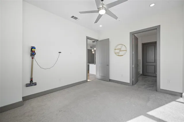 an empty room with white walls and painted walls