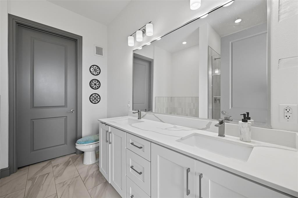 2700 Old Denton Road, Unit 3310 Carrollton, TX 75007 - Photo 8 of 21 a bathroom with a sink a toilet and shower