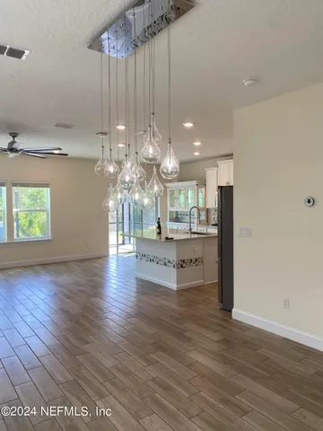 a open kitchen with a table and chairs