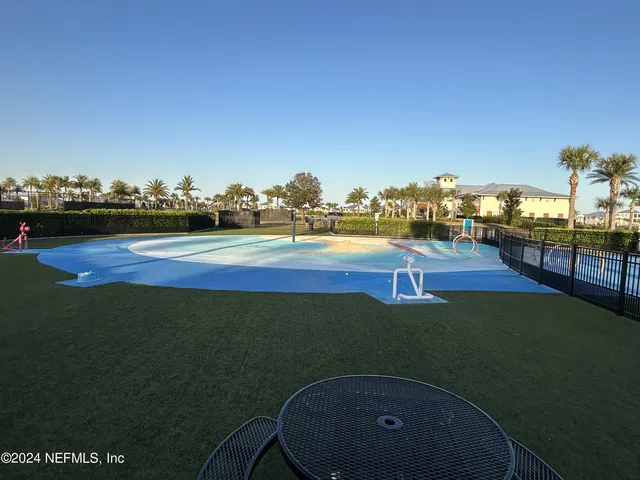 an aerial view of a house with a lake view