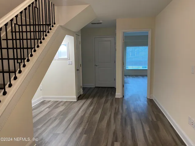 a view of entryway with wooden floor