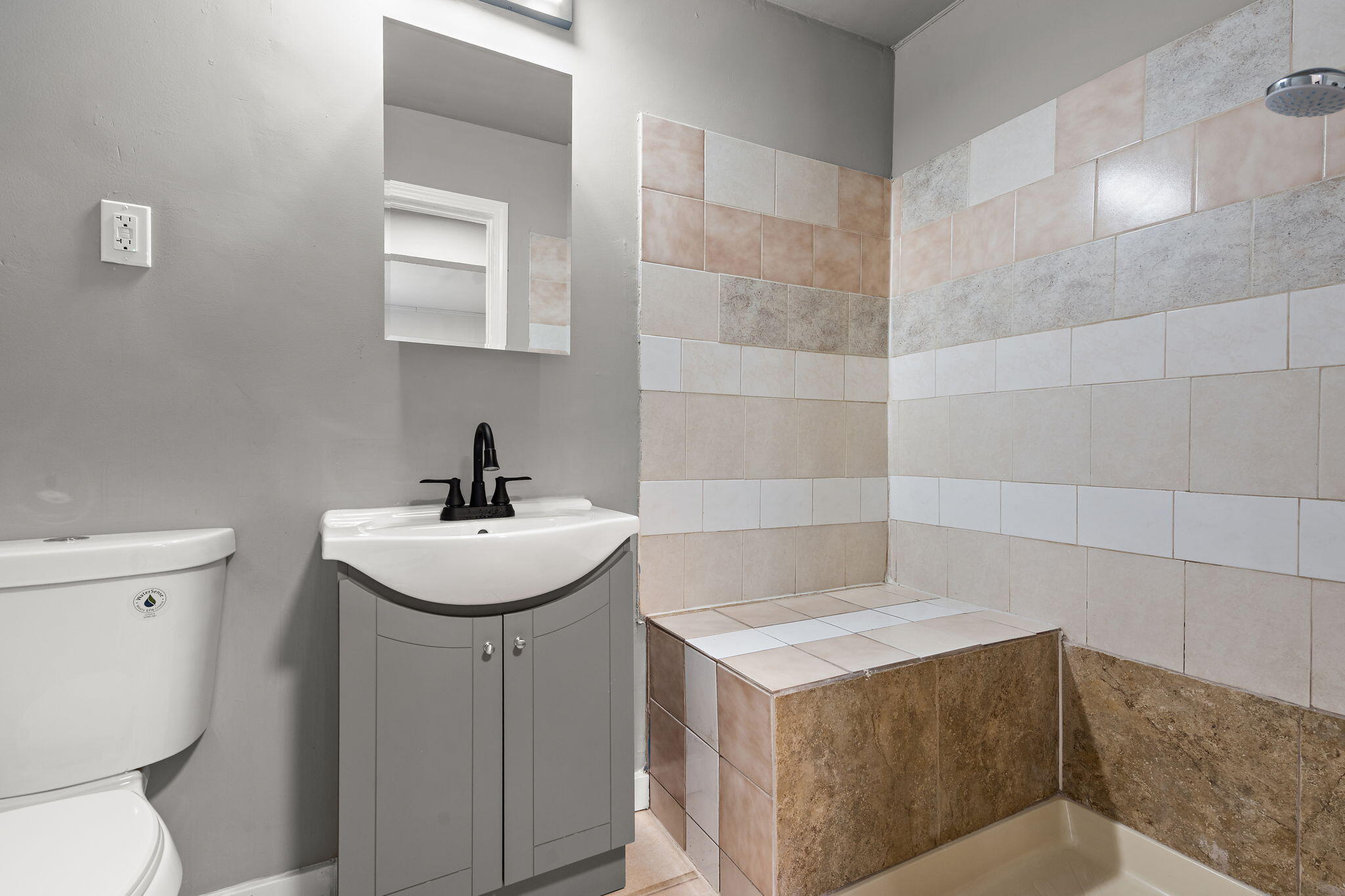 565 Jackson Street Gary, IN 46402 - Photo 12 of 24 a bathroom with a sink toilet and mirror