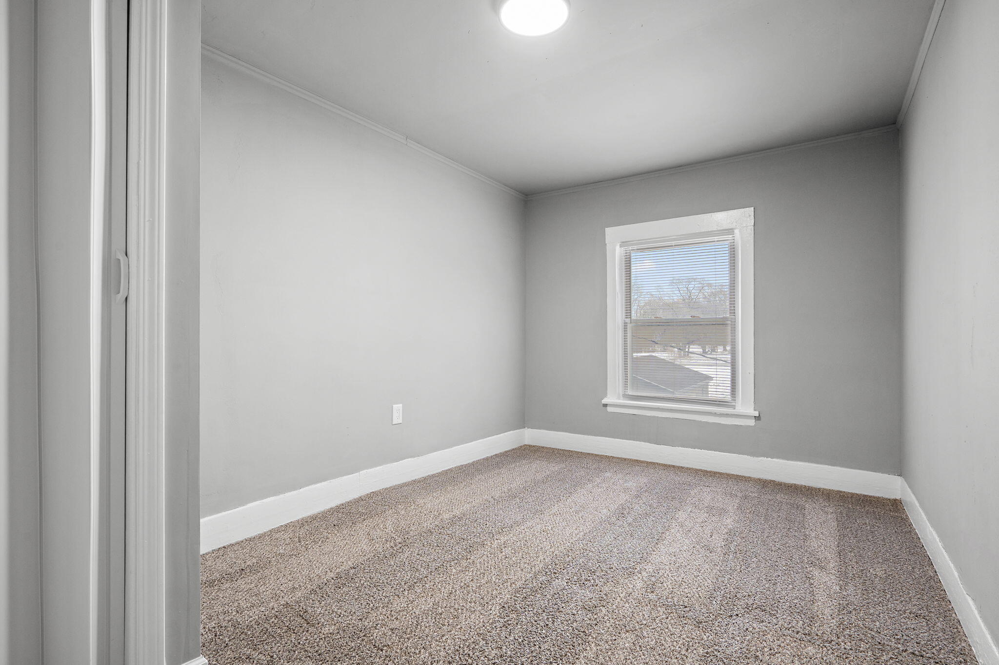 565 Jackson Street Gary, IN 46402 - Photo 18 of 24 an empty room with windows