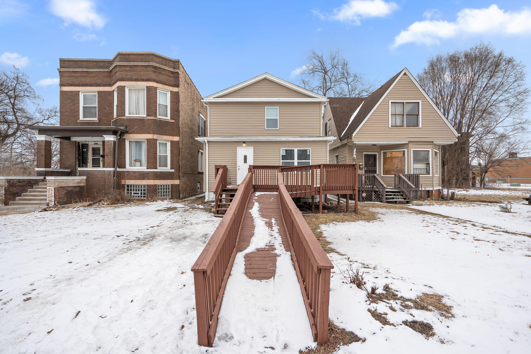 565 Jackson Street Gary, IN 46402 - Photo 2 of 24 a front view of a house with a yard