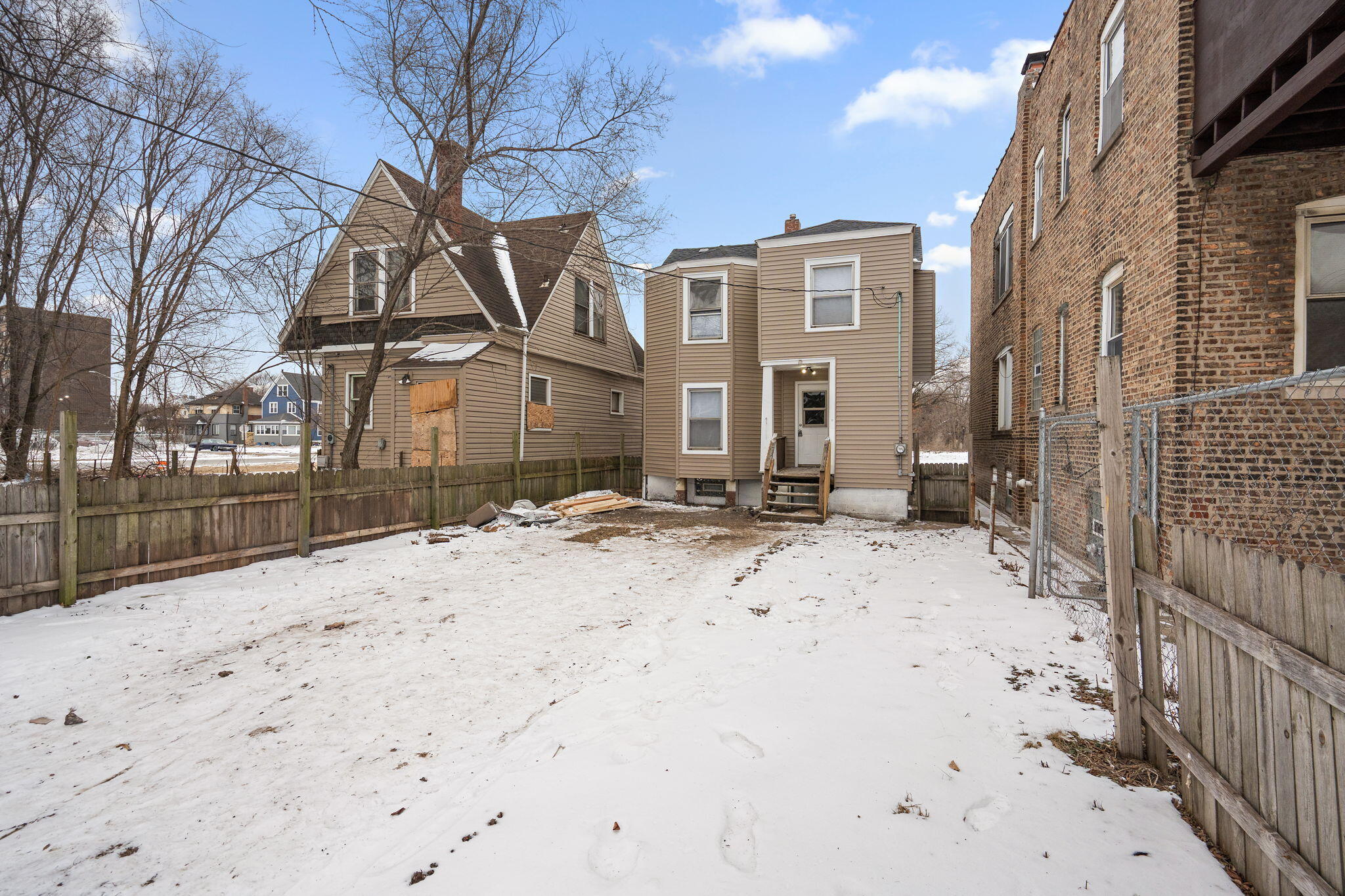 565 Jackson Street Gary, IN 46402 - Photo 22 of 24 a view of a house with a snow in the yard